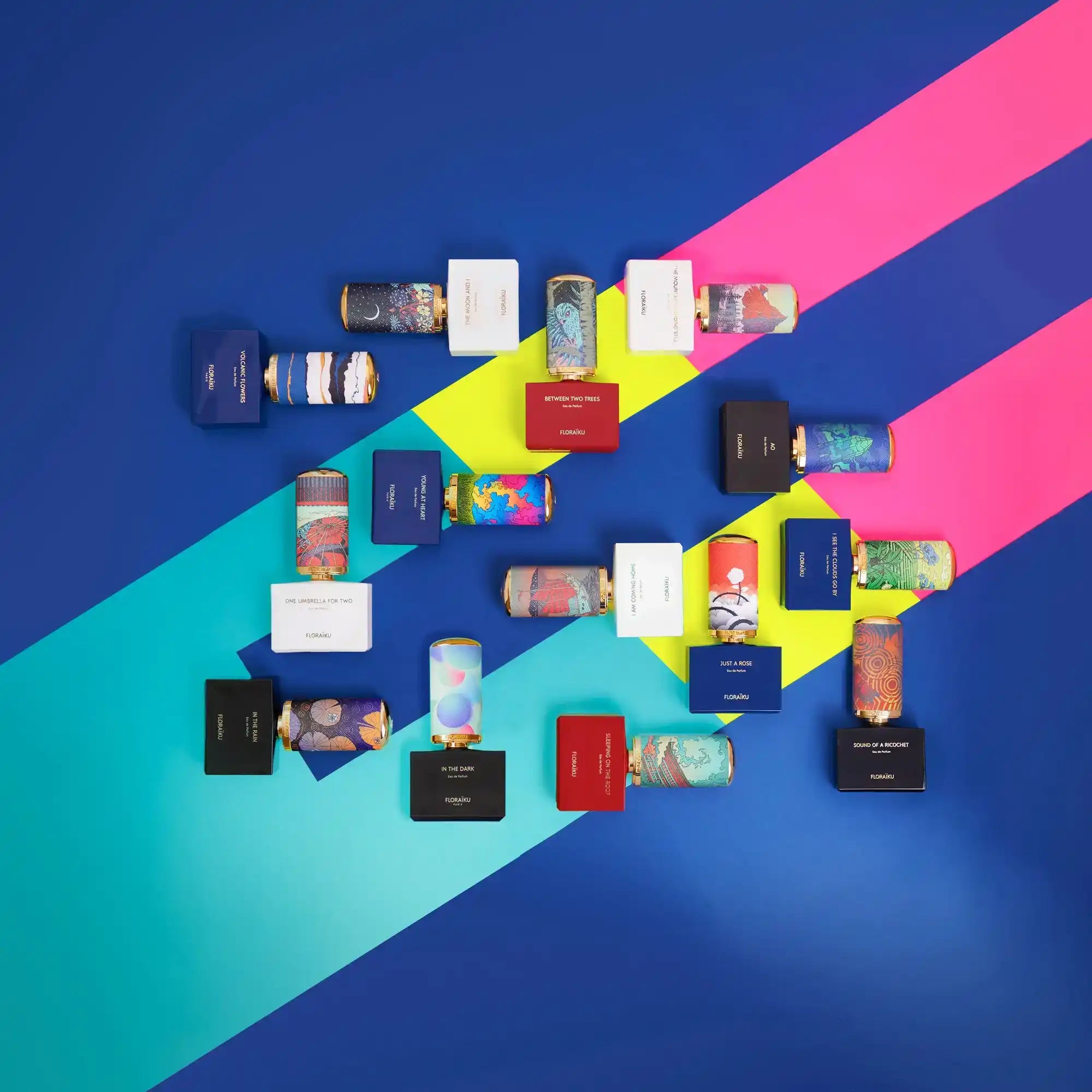A collection of colorful perfume bottles and their packaging.