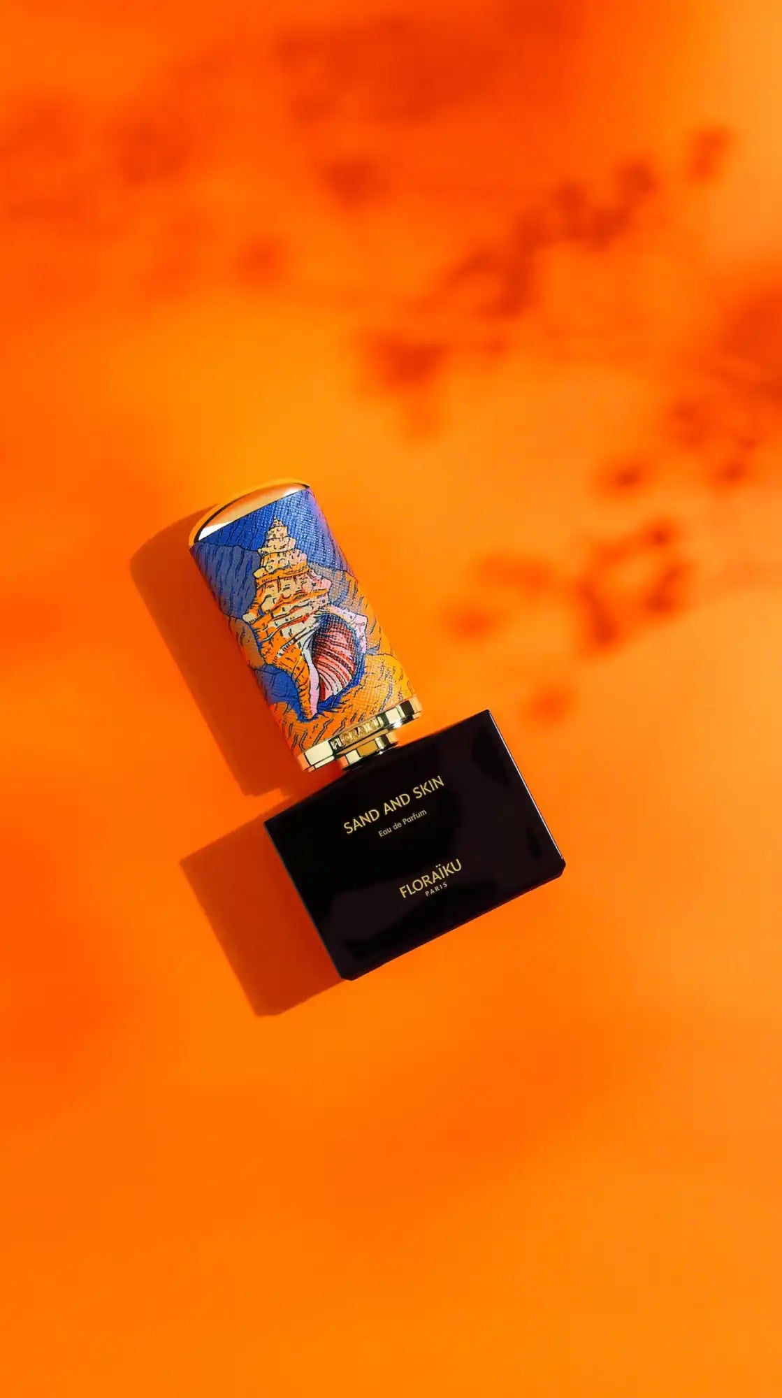 A compact makeup palette with a decorative lipstick case.